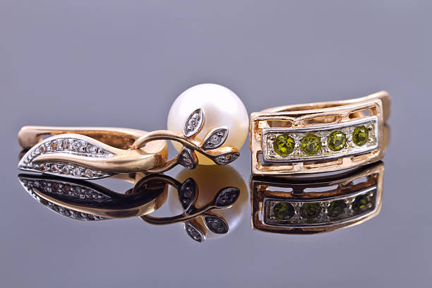 istock gold earrings with emeralds and with pearl 489380064