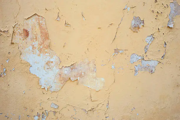 Peeling painted wall in the urban building