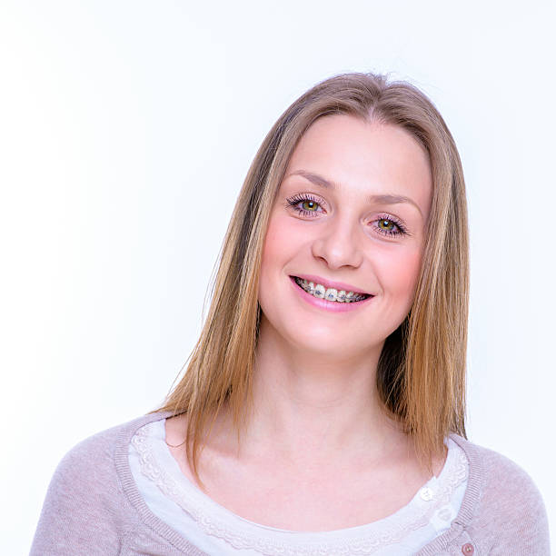 istock happy beautiful girl with braces 489381134