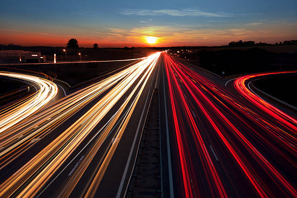 istock Speed Traffic  long exposure on  highway at sundown time 489381368