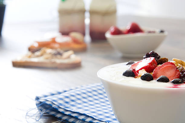istock Natural yogurt with fresh berries and toasted with fruit 489384398