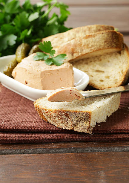 istock homemade meat pate with pickles and white bread 489385088