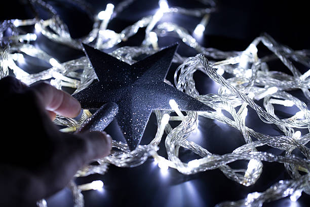 istock Christmas star with Christmas lighting bulbs 489386238