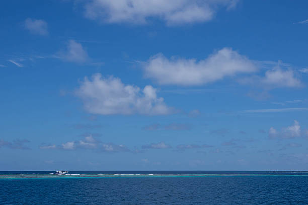 istock Seascape with boat and cloudy sky 489387184