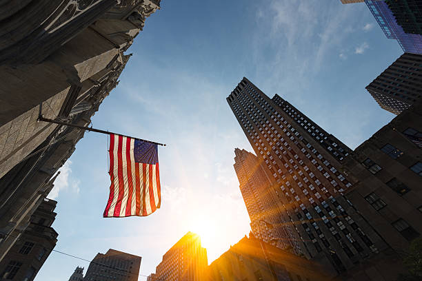 istock High rise buildings and US Flag at sunset 489387952