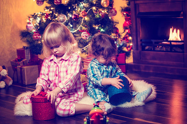 istock Christmas Kids in Pyjamas with Presents 489388154