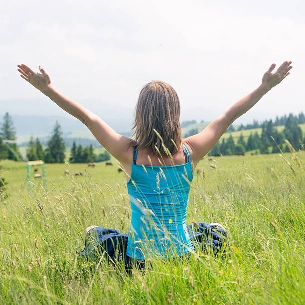 istock Woman Meditate at the Mountains 489424852