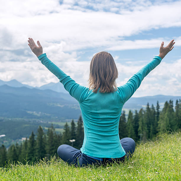 istock Woman Meditate at the Mountains 489425136