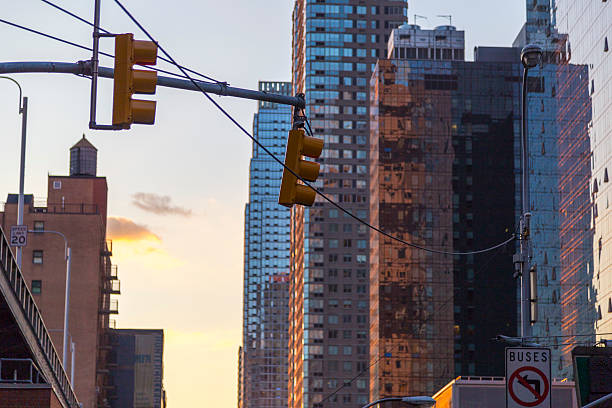 istock Traffic light with skyscrapers in background in NYC at sunset 489425354