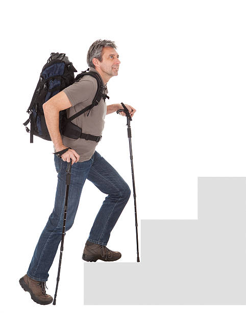 istock Senior man with backpack and hiking poles 489426307