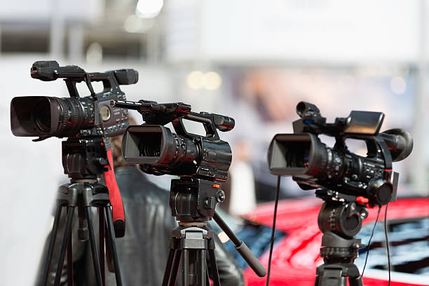 istock Media cameras covering outdoor event 489426909