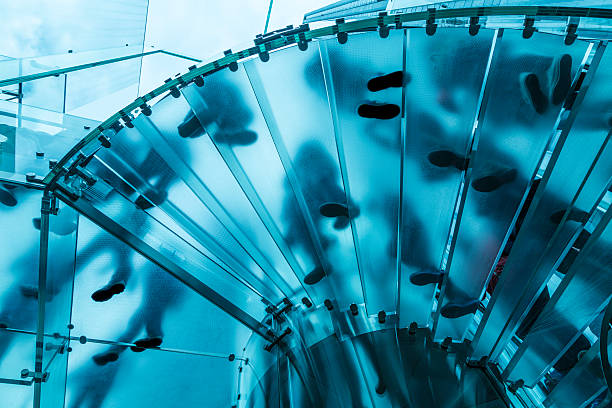 Feet On Glass Spiral Stairs