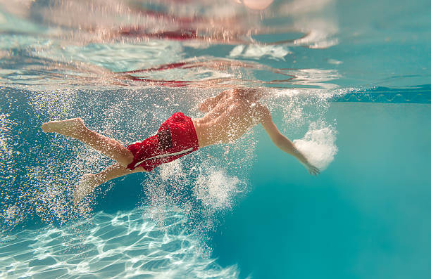 istock kid having a good time in the pool 489427267