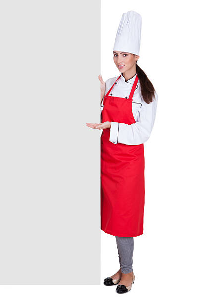 istock Happy Female Chef Holding Placard 489427579