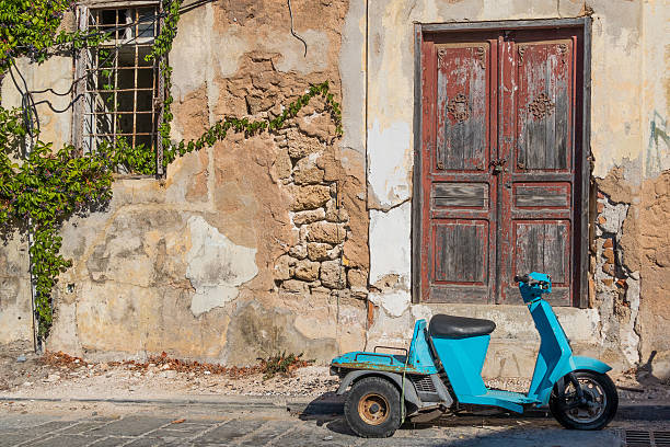 A derelict building and motorcycle in Rhodes Town on the Greek Island of Rhodes, Greece