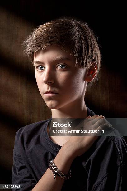 Portrait Of A Male Teenager With Brown Background Stock Photo - Download Image Now - Depression - Sadness, Teenager, Boys