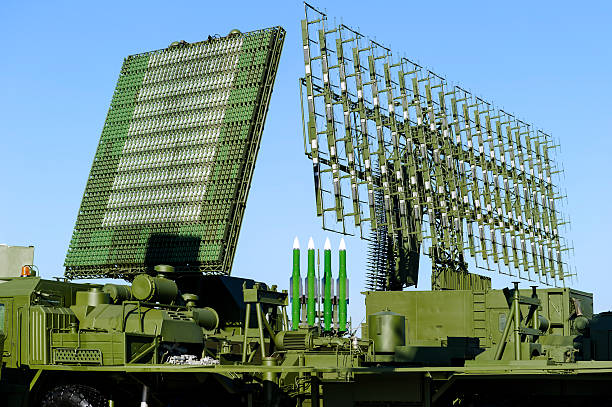 Radars and rocket launcher Air defense radars of military mobile antiaircraft systems in green color and ballistic rocket launcher with four cruise missiles in centre of frame, modern army industry  anti aircraft photos stock pictures, royalty-free photos & images