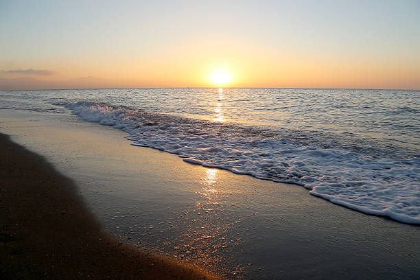 istock Waves of the sea, illuminated by sunlight at sunset. 489428602