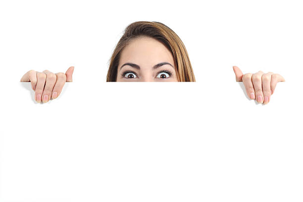 istock Surprised woman eyes over a blank promotional display 489430269