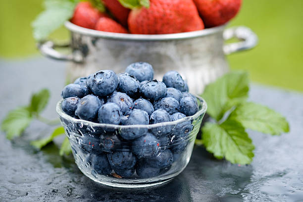 Blueberry and Strawberry in Bowls. stock photo