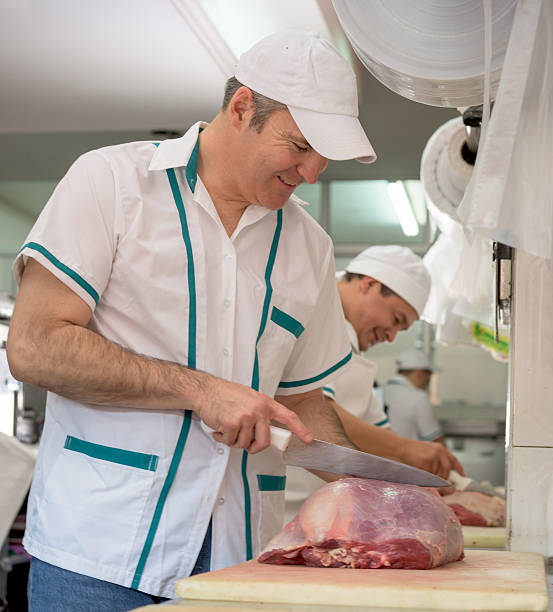 istock Men cutting meat at the butchery 489432704