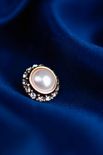 Close-up view of   woman bracelet and earrings jewelry on white background .