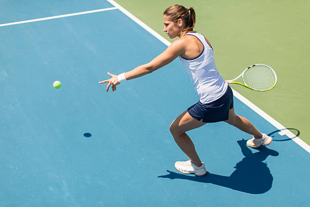 istock Young woman playing tennis 489433128