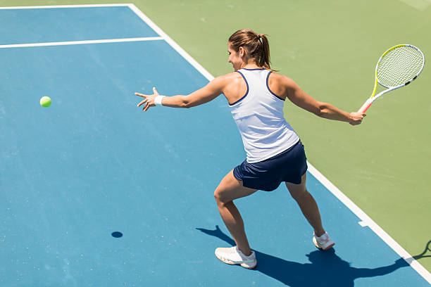 istock Young woman playing tennis 489433350