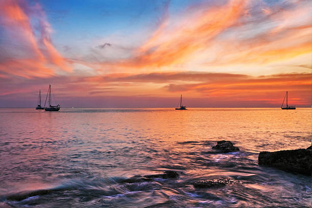 istock Yachts in the sea at sunset 489433892