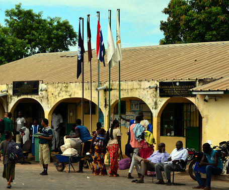 Amdallai, Gambia - September 2, 2015: people wait at border crossing between The Gambia and Senegal