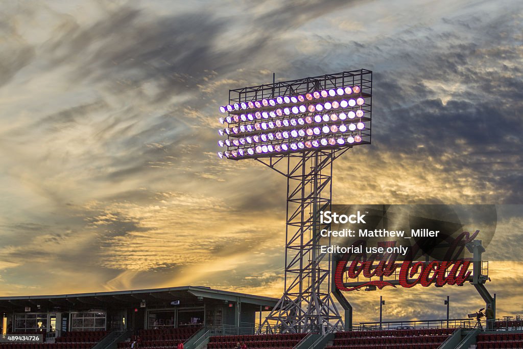 Fenway Park Coca Cola Sign at Sunset Boston MA, United States - September 21, 2015: The sun sets at Fenway Park in Boston MA behind the giant Coca Cola sign. Baseball - Sport Stock Photo