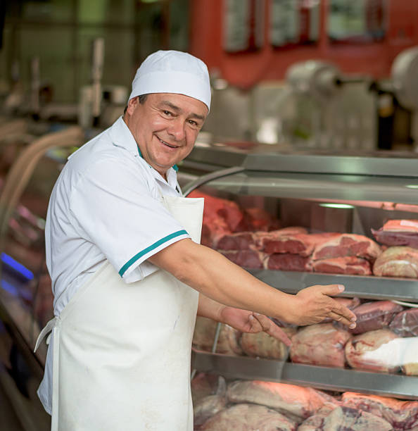 istock Butcher displaying meat at the butchery 489436060