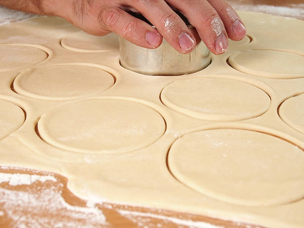 istock Cutting Dough into circles. Preparation Meat Dumplings. 489436306