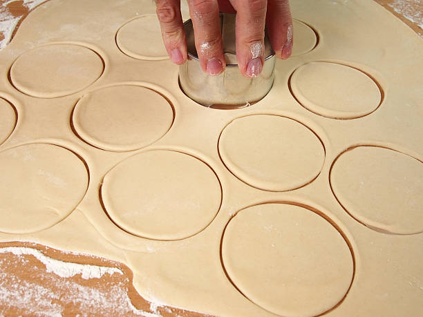 istock Cutting Dough into circles. Preparation Meat Dumplings. 489436316