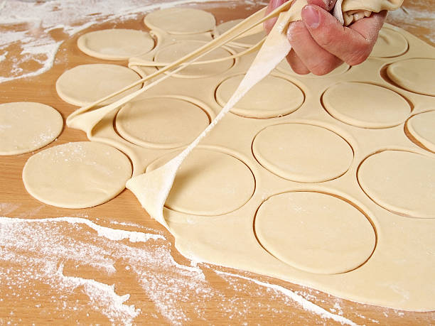 istock Removing cut off dough. Preparation Meat Dumplings. 489436326