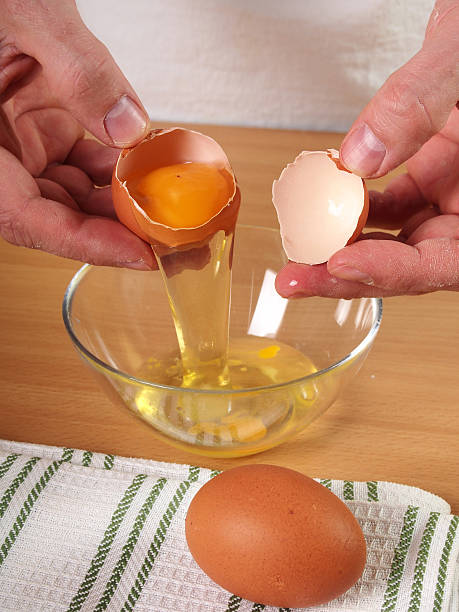 istock Crack egg into bowl. Making Apple Pie Tart Series. 489436754