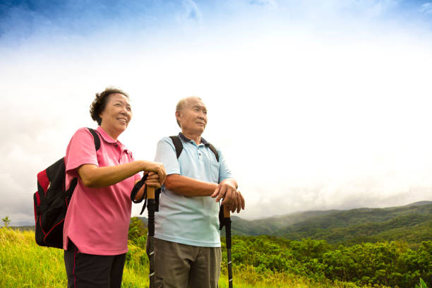 istock happy senior couple hiking on the mountain 489439152