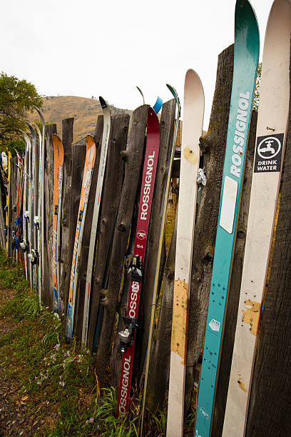 Jackson, United States - August 26, 2015: Fence made from old skis, downtown Jackson, Wyoming, on a rainy summer day, vertical image.