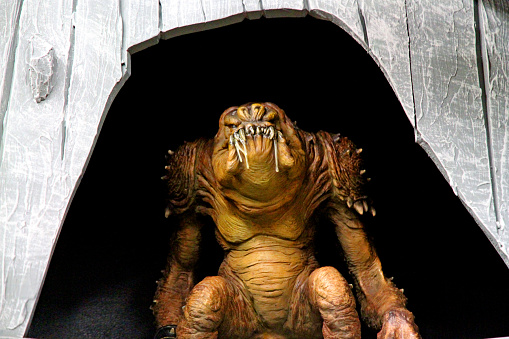 Vancouver, Canada - August 17, 2015: A rancor in it's cave. The rancor is an alien creature defeated by Luke Skywalker in the Return of the Jedi Star Wars Film. The toy is by Hasbro 