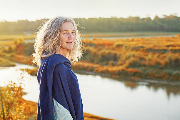 old beautiful women on a shore of river