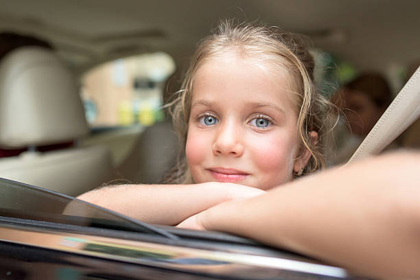 istock Little girl sitting in a car 489479322