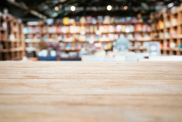 Table top Counter with Blurred Bookshelf Bookstore Background