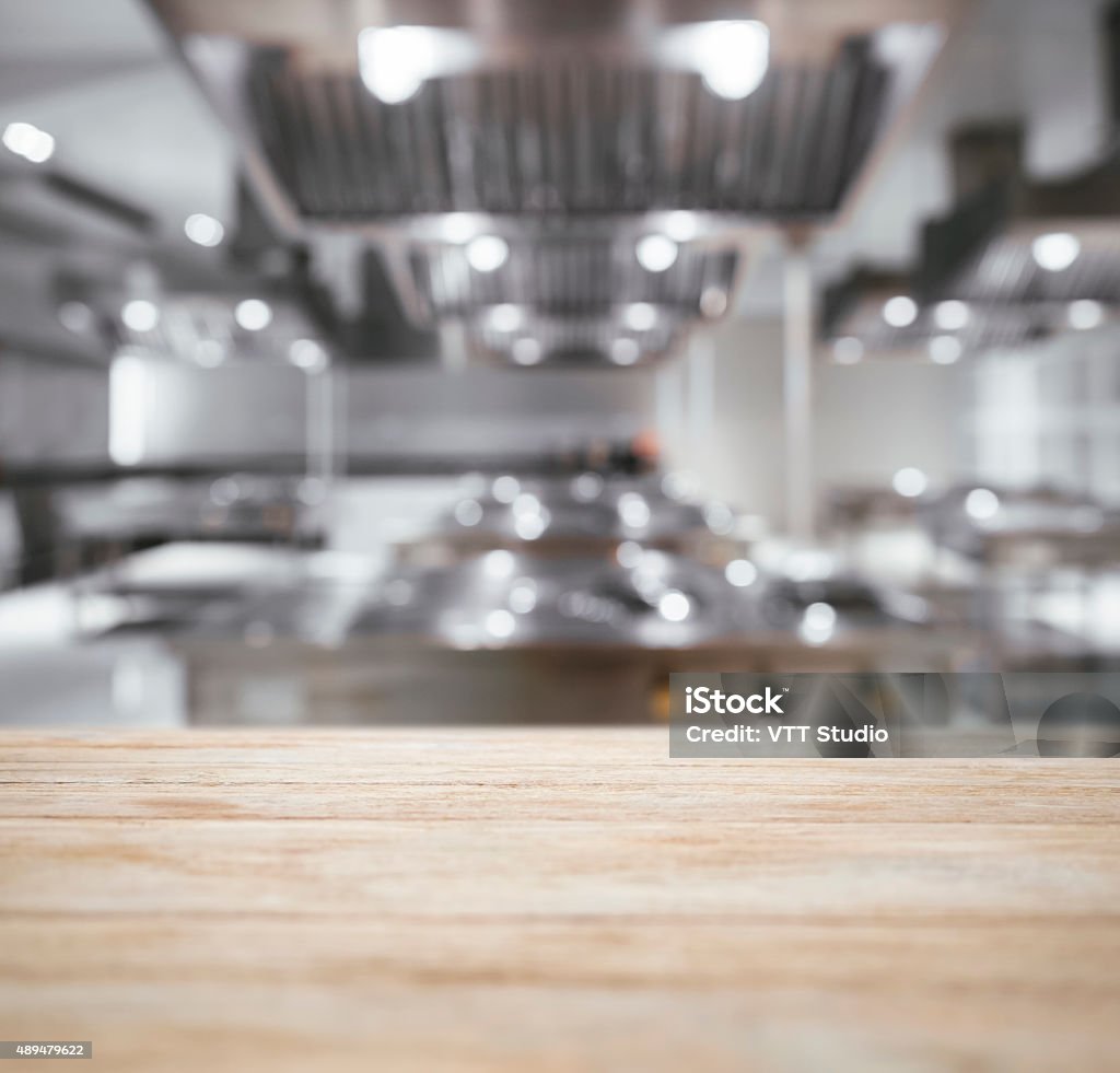 Table top Counter with Blurred Kitchen Background Commercial Kitchen Stock Photo