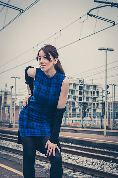 istock Pretty girl posing along the tracks 489481049