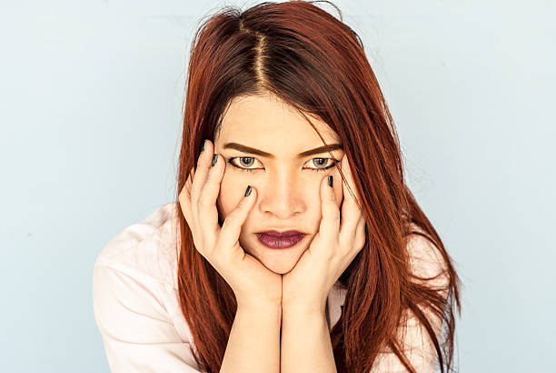 istock serious young woman pondering over something. 489481668