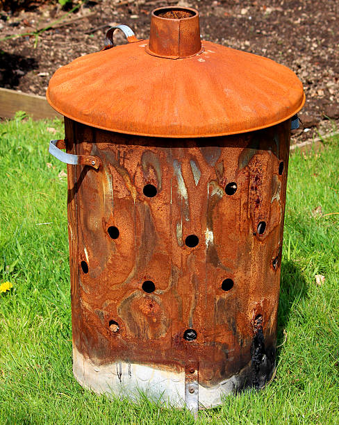 istock Image of rusty garden waste incinerator bin, on lawn grass 489481731