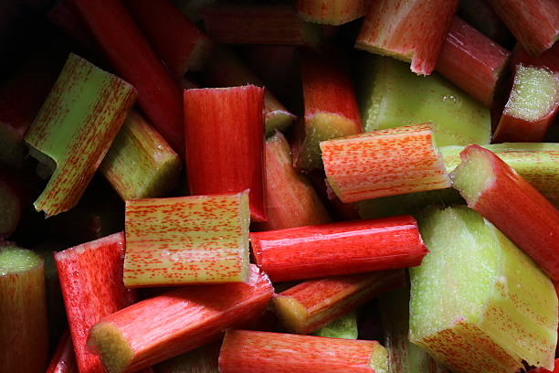 istock rhubarb freshly harvested and cut in pieces at spring 489481907