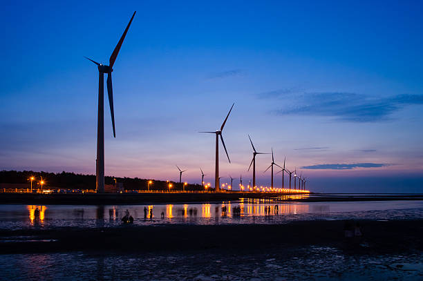 istock Wind turbines by the sunset 489482265