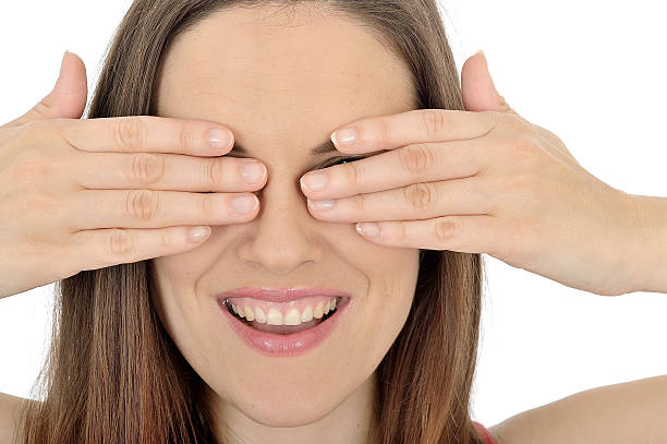 istock Young Woman Covering her Eyes 489482919