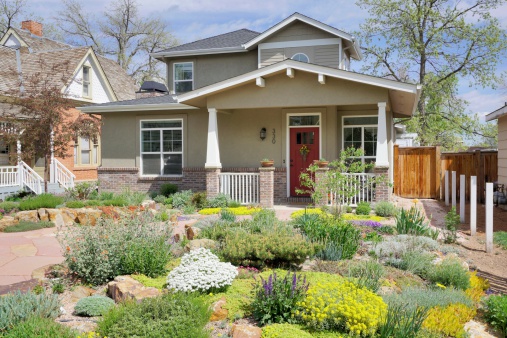 Fort Collins, Colorado, USA - May 10, 2014: Neighborhood with historic homes and beautiful landscaping in the Old Town of Fort Collins, Colorado.